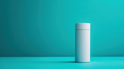 Blank white cylinder container on turquoise background