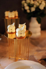 Chocolate pastries on a beautiful stand in the buffet.