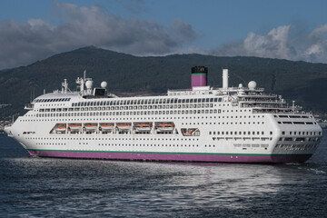 Classic cruiseship cruise ship liner Ambience sail away departure from Vigo port, Spain in Galicia...