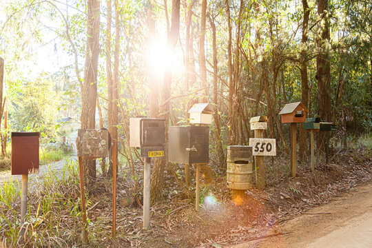 Row of mailboxes beside gravel country road