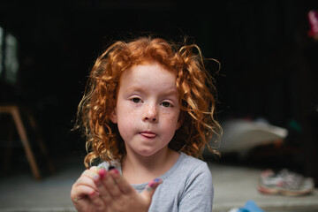 Portrait of a young girl with a serious expression