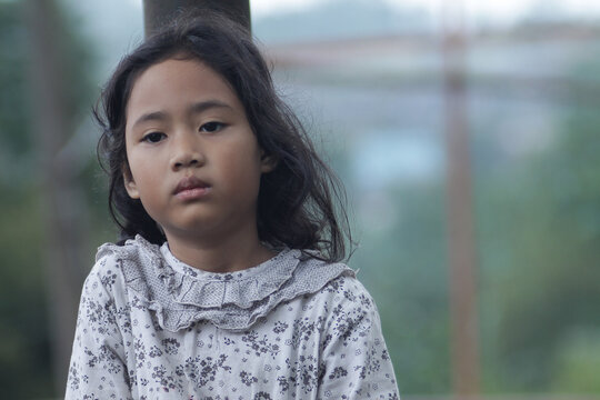 little girl with a natural cold expression