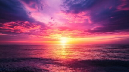 Obraz premium A sunrise over a vast ocean, with the sky exploding in rich hues of pink, purple, and fiery orange