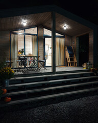 Wood-trimmed porch of a summer house in the night. Wide porch with four steps leading to a summer...