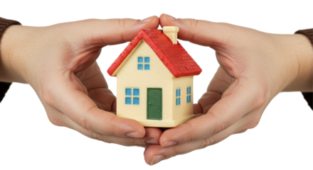 Isolated Miniature House Held in Human Hands