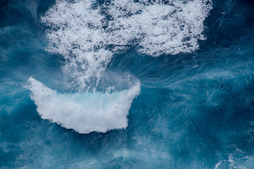 Huge crushing waves seen from above creating amazing textures.	