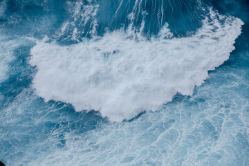 Huge crushing waves seen from above creating amazing textures.	