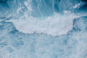 Huge crushing waves seen from above creating amazing textures. 