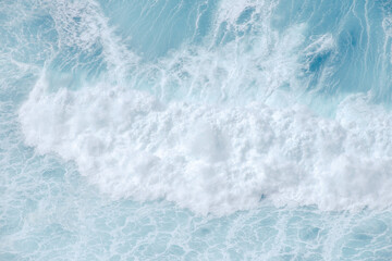 Huge crushing waves seen from above creating amazing textures.	
