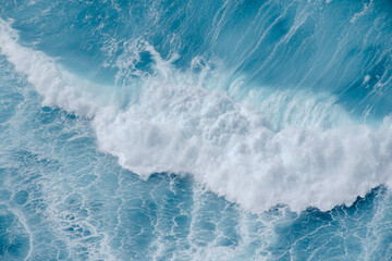 Huge crushing waves seen from above creating amazing textures.	