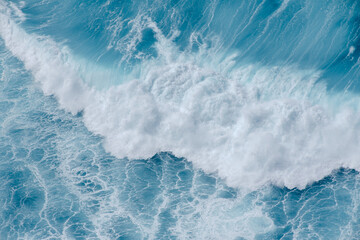 Huge crushing waves seen from above creating amazing textures.	