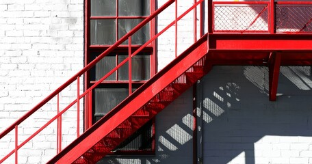 Shadows play an essential role in enhancing the design of the red fire escape.