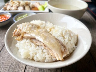 Steamed rice topped with chicken Singaporean food