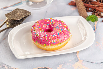 Sweet donut with strawberry icing