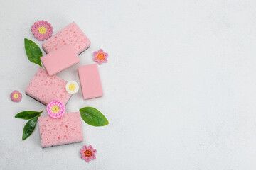 Various sponges for washing dishes. Organic cleaning concept, lemon freshness. Stone background