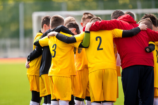 Teammates Motivational Speech With Coach Before the Match. Sports Youth Team United in a Circle. Football; Soccer; Volleyball; Match for Children. The Team Cry Before the Football Soccer Game