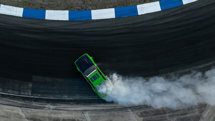 Motorsport car drift on asphalt race track with lot of smoke from burning wheel tires rubber, Drift...