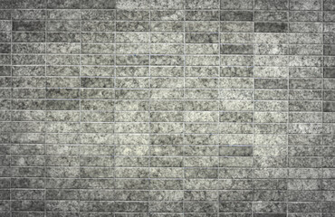 Gray color aged brick wall.