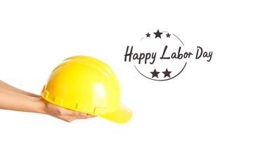 hand holding a yellow hard hat with the words happy labor day written on it
