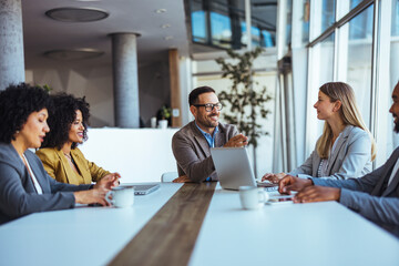 Group of Professionals Engaged in a Collaborative Business Meeting in Modern Office