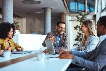 Team Collaborating During Office Meeting in a Modern Workspace Setting