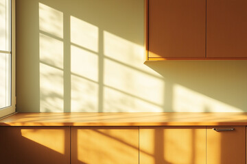 modern kitchen countertop with wooden cabinets illuminated by warm sunlight through window creating cozy home atmosphere