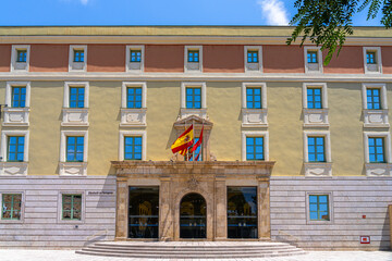 View of the office building of the council of Tarragona province with national flag of Spain and flag of Tarragona in summer, Catalonia, Spain