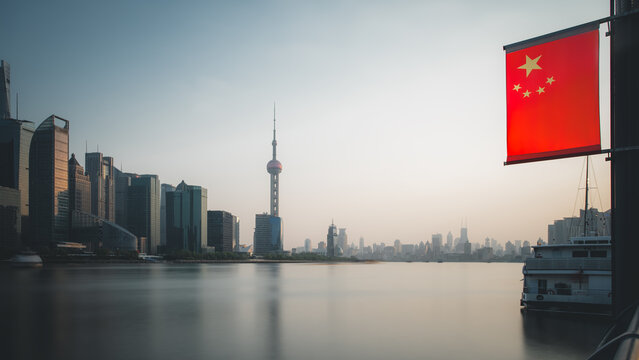 Serene Shanghai Skyline at Dusk with Chinese Flag - Powered by Adobe