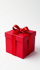 Obraz premium Vibrant red gift box with shiny ribbon, isolated on white background, celebration, Christmas