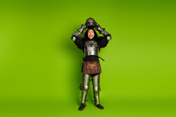 Portrait of aged primeval caveman hold animal skin leather isolated on yellow color background