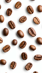 Scattered roasted coffee beans on white background