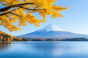 Scenic autumn view of a snow-capped mountain reflected in a calm lake, framed by golden foliage