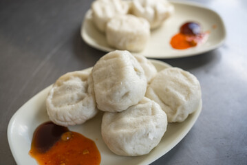 Fresh steamed dumplings served with sauce