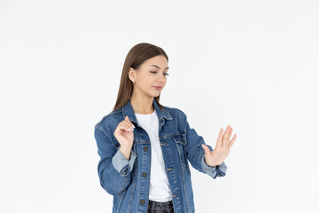 Young caucasian woman looking at manicure on white background