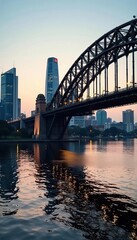 Naklejka premium The iconic Story Bridge against the backdrop of Brisbane city during the early morning light, destination, sunrise