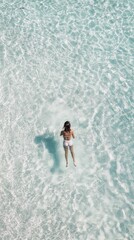 A girl is swimming in the clear sea, drone shot, top view, minimalism, pastel colors, phone wallpaper