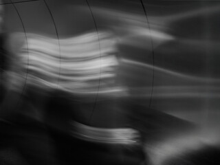 Artistic Long Exposure of a Woman's Face with Wave-like Motion in Black and White