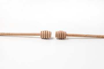 wooden honey spoon isolated on white background