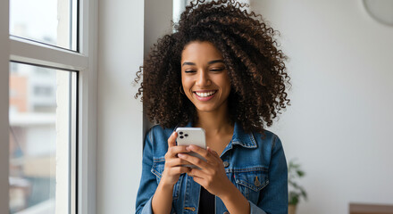 Happy Woman Using Smartphone by Window in Bright Room