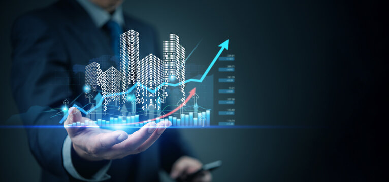 Business hand showing futuristic skyline with finance graph, smart city concept, economic growth, investment planning, real estate tech, digital economy, data trend. - Powered by Adobe