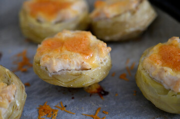 Delight in savory stuffed artichokes fresh from the oven, showcasing golden cheese atop tender vegetables