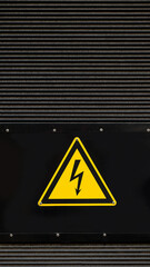Electrical hazard sign with a lightning bolt on a black background. A warning symbol of high...