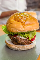 Delicious Homemade Burger with Fresh Ingredients. Classic hamburger