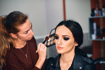 Professional Makeup Artist Creating a Bold Look