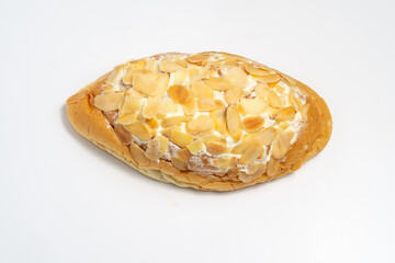A Danish Swirl pastry with almond cream and sliced almonds on top. A sweet treat with flaky layers, isolated on a white background.