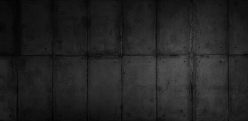 texture showcasing a dark black concrete wall with a distinct panel pattern, reflecting the...
