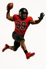 Athletic man in helmet and red jersey jumping and holding football ball isolated on white background. Concept of sport, motion, power, strategy, competition, game, team spirit, speed, action.