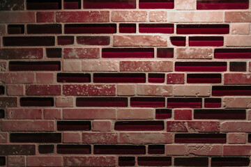 Obraz premium tile design with a mix of light red, pink, and darker burgundy bricks, some which are replaced with dark red glass mosaic backsplash tiles background. interior decor design element.