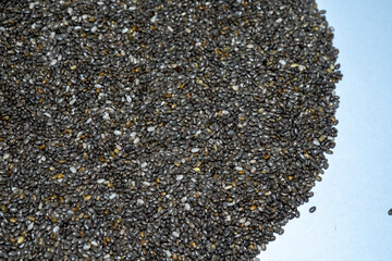A close-up captures the intricate texture of chia seeds, a superfood packed with nutrients. Tiny...