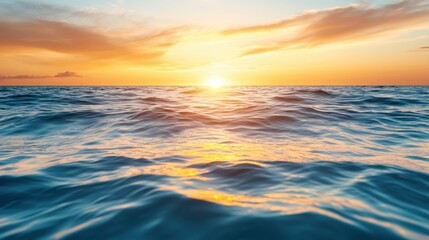 Obraz premium A breathtaking view of the ocean waves gently rolling under a stunning sunset, creating a perfect fusion of colors and tranquility in nature's beauty.